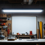 A photograph of a well-lit workshop or garage space featuring an 8-foot led shop light in action