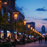 A photograph of a bustling urban street at dusk