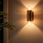 A photograph of a beautifully designed wall sconce in an elegantly lit interior setting