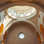A photograph of a beautifully lit cathedral ceiling