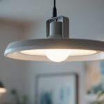 A photograph of a well-lit room showcasing a modern light fixture mounted securely with a sleek bracket