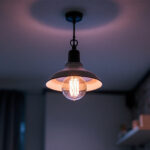 A photograph of a stylish hanging ceiling lamp in a well-lit interior setting