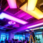 A photograph of a well-lit workspace featuring fluorescent lights with vibrant light diffusers installed