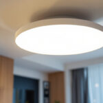 A photograph of a modern flat led ceiling light installed in a stylish interior space
