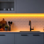 A photograph of a beautifully lit kitchen featuring under counter led lighting