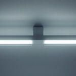 A photograph of a well-lit interior space showcasing the 2 lights fluorescent ho light fixture in use
