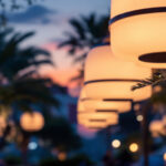 A photograph of a beautifully illuminated outdoor space featuring large light fixtures