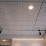 A photograph of a well-lit interior space featuring a drop ceiling installation