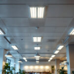 A photograph of a well-lit commercial space featuring a drop ceiling with 2x4 led lights installed