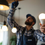 A photograph of a lighting contractor installing or showcasing type b light bulbs in a residential or commercial setting