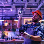 A photograph of a lighting contractor efficiently installing led fixtures in a modern workspace