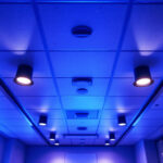 A photograph of a well-lit drop ceiling installation in a commercial space
