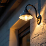 A photograph of a lighting contractor skillfully installing a stylish light gooseneck fixture on a building exterior