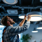 A photograph of a well-lit room showcasing various ceiling light fixtures in action
