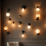 A photograph of a beautifully arranged display of various wall sconce light fixtures in a stylish interior setting