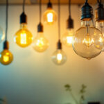 A photograph of a brightly lit room showcasing various light bulbs in different colors and styles