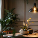 A photograph of a beautifully designed pendant dining room light hanging above an elegantly set dining table