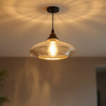 A photograph of a beautifully designed ceiling hanging light fixture in a stylish interior setting