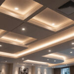 A photograph of a beautifully designed ceiling featuring recessed lighting installed within ceiling tiles