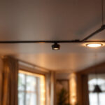 A photograph of a beautifully lit interior space featuring ic-rated can lights installed in the ceiling