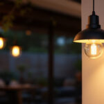 A photograph of a beautifully designed exterior pendant light illuminating a cozy outdoor space