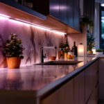 A photograph of a stylish kitchen with under counter led lights illuminating the countertop