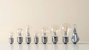 A photograph of a close-up of various standard light bulb bases arranged on a clean