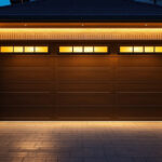 A photograph of a well-lit garage entrance at dusk