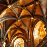 A photograph of a beautifully designed cathedral ceiling featuring stylish can lights