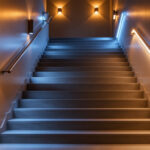 A photograph of a beautifully illuminated staircase showcasing various lighting options