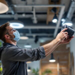 A photograph of a well-lit indoor space showcasing various lighting fixtures