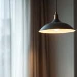 A photograph of a stylish large pendant light fixture installed in a modern living space