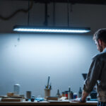 A photograph of a well-lit workshop or garage space featuring an 8 ft led shop light installed overhead