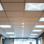A photograph of a well-lit drop ceiling installation in a commercial space