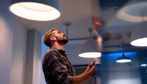 A photograph of a well-lit room featuring low ceiling lights in action