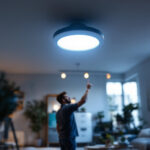 A photograph of a well-lit room featuring an 8-inch can light installed in the ceiling