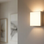 A photograph of a stylish flat wall sconce elegantly illuminating a modern interior space