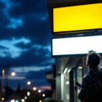 A photograph of capture a photograph of a well-lit exterior business sign at dusk