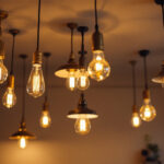 A photograph of a well-lit room featuring a variety of stylish ceiling lights with visible bulbs