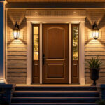 A photograph of a beautifully illuminated exterior door showcasing stylish lighting fixtures that enhance the home's entrance