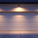 A photograph of a beautifully lit garage exterior at dusk