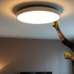A photograph of a stylish ceiling flush mount light installed in a modern interior setting