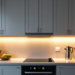 A photograph of a beautifully designed kitchen showcasing under cabinet plug-in lighting