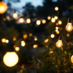 A photograph of a beautifully illuminated outdoor space featuring various styles of solar light bulbs in use