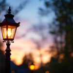 A photograph of a beautifully designed gaslight lamp in an outdoor setting