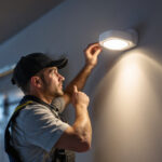 A photograph of a well-lit garage showcasing a modern motion sensor light in action