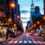 A photograph of a beautifully lit new york city street scene at dusk