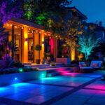 A photograph of a beautifully illuminated outdoor space featuring a variety of colored lights in use