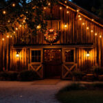 A photograph of a rustic barn setting illuminated by warm