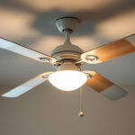 A photograph of a well-lit ceiling fan showcasing its various components